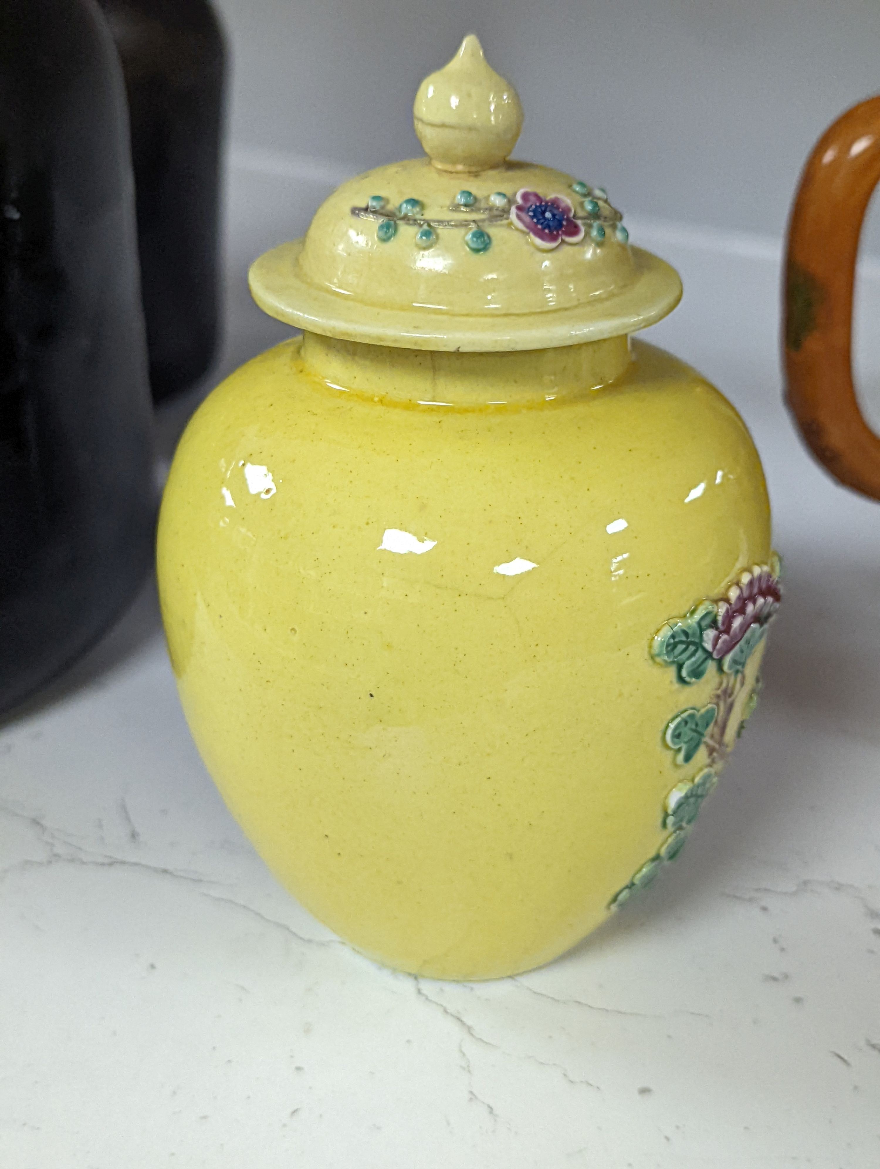 A Chinese enamelled yellow-ground jar and cover, a pottery teapot and cover and a flambe vase, latter 13cm